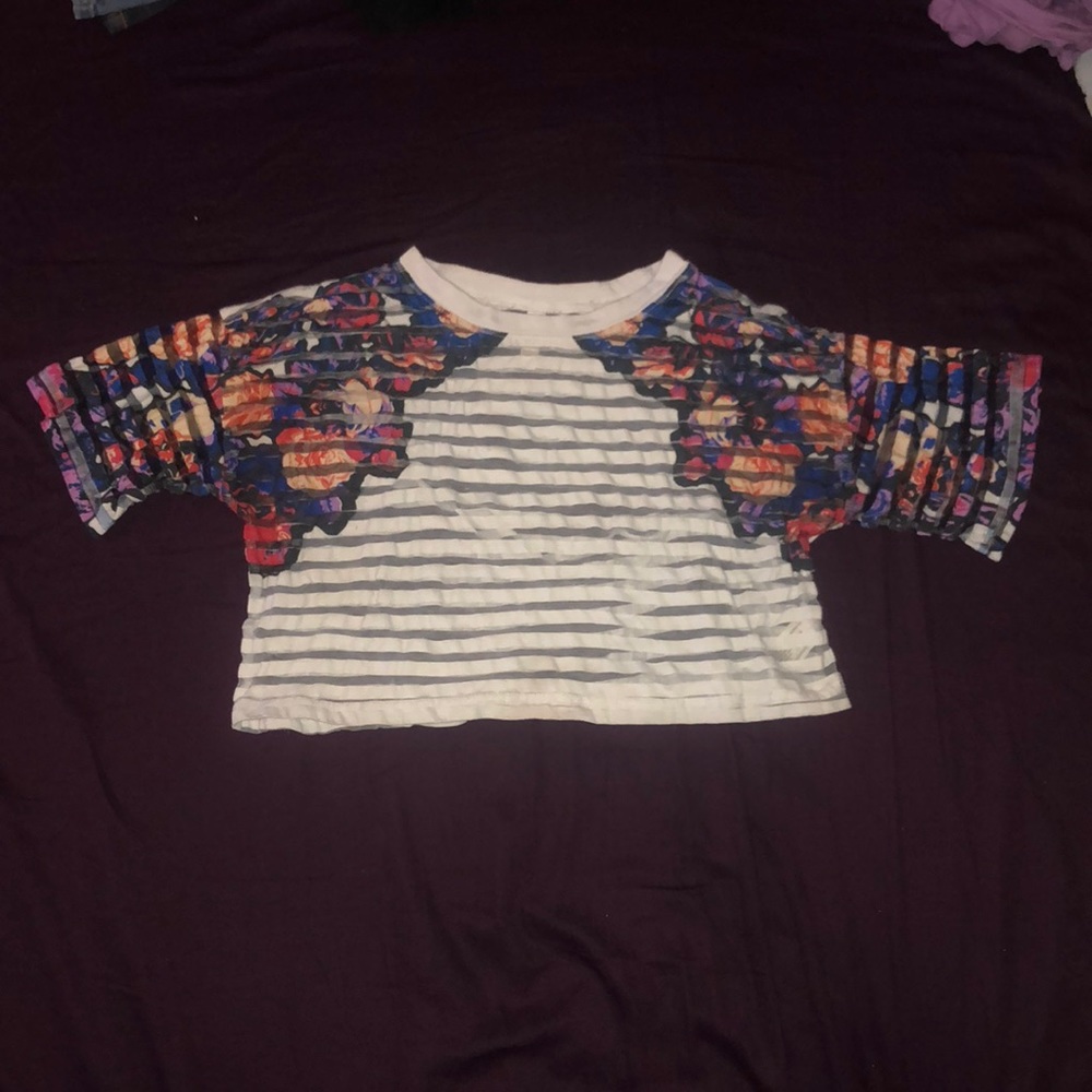 A cropped see through floral shirt.
